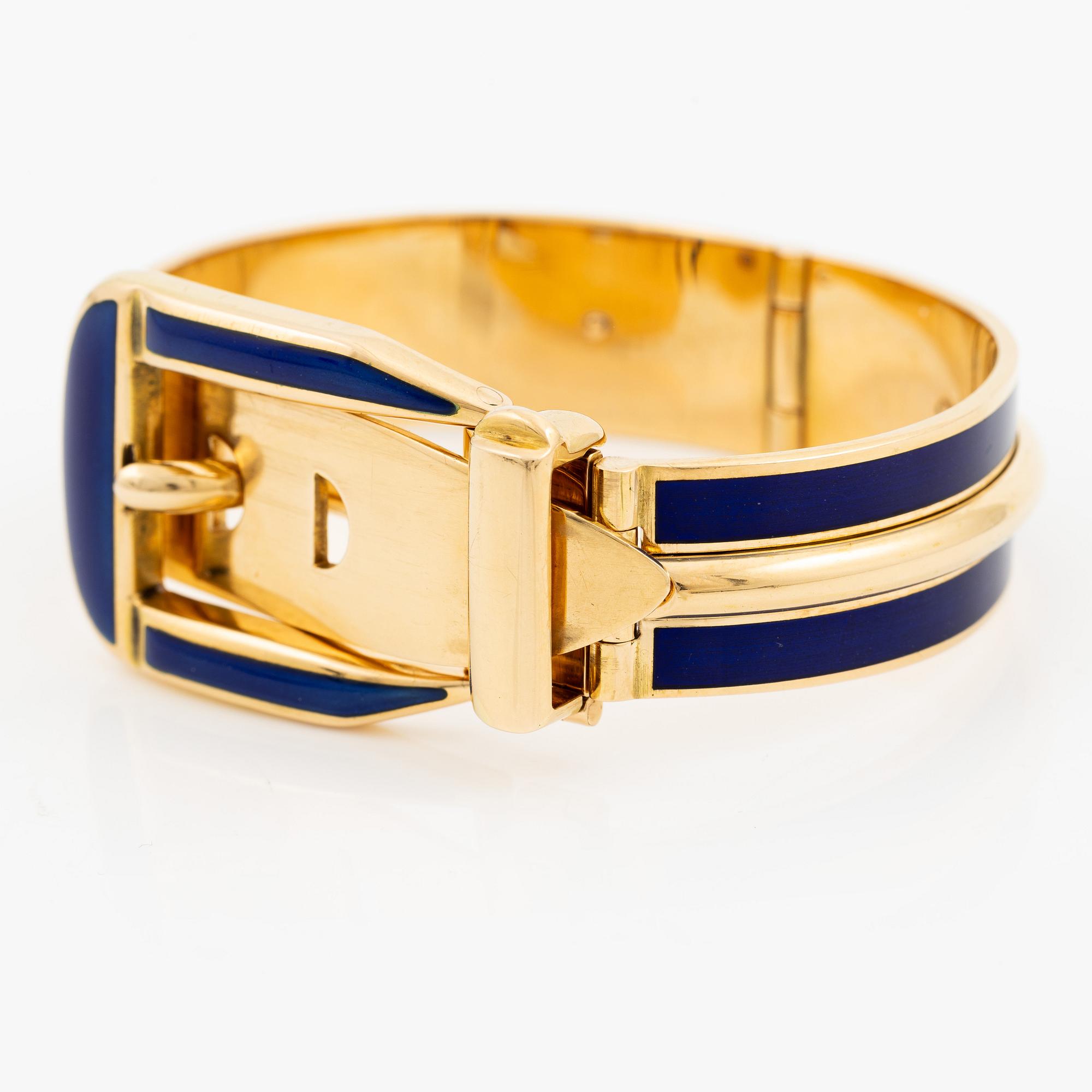 A Gucci bracelet 18K gold with blue enamel.