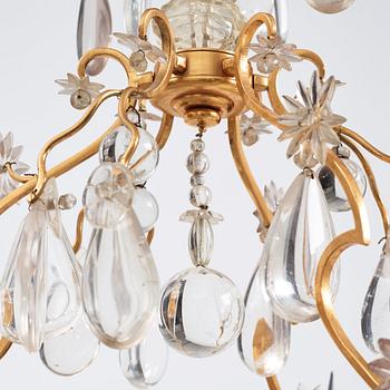 A Louis XV-style rock crystal eight-light chandelier, 20th century.