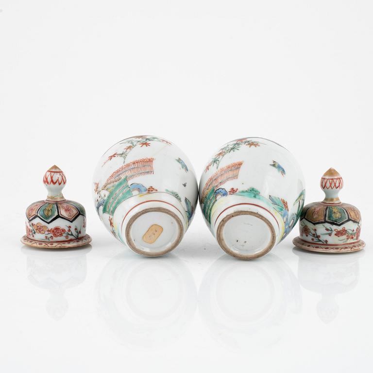 A pair of Japanese jars with covers, circa 1900.