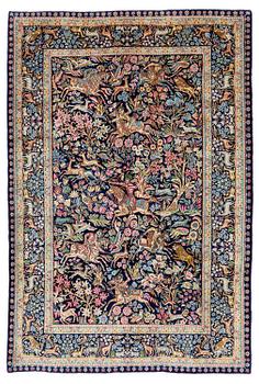 418. A semi-antique Kirman carpet, south eastern Iran, c. 278 x 188 cm.