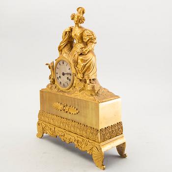 A mid 1800s bronzed late empire table clock.