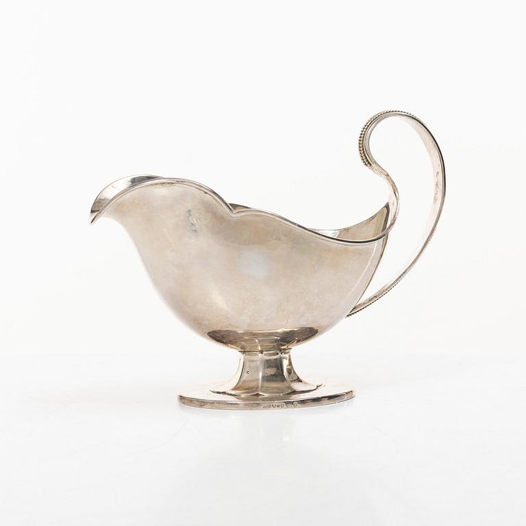 Sauceboat and four punch cups, silver, Sweden, 20th century.