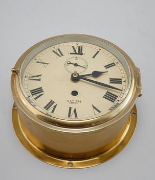 A wall clock from Smith Empire and a barometer, made in the fourth quarter of the 20th century.