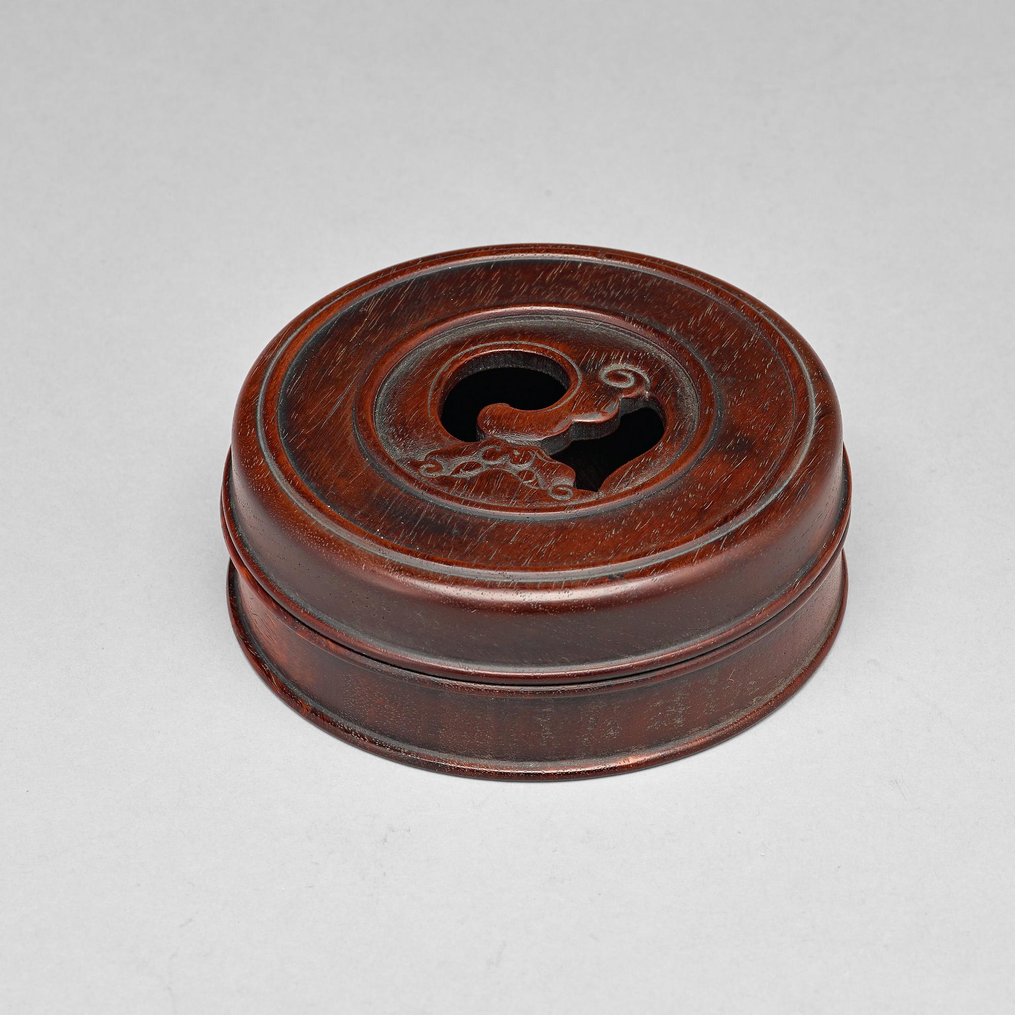A Chinese wooden box with cover.