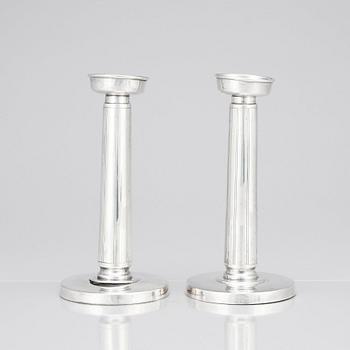 Gustaf Janson, a pair of sterling candlesticks, C.G Hallberg Stockholm 1961.