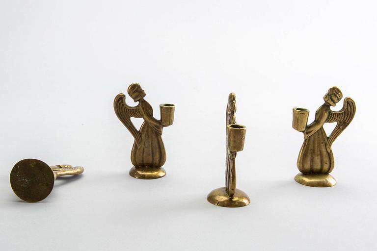 Four second half of the 20th century brass CANDLESTICKS.