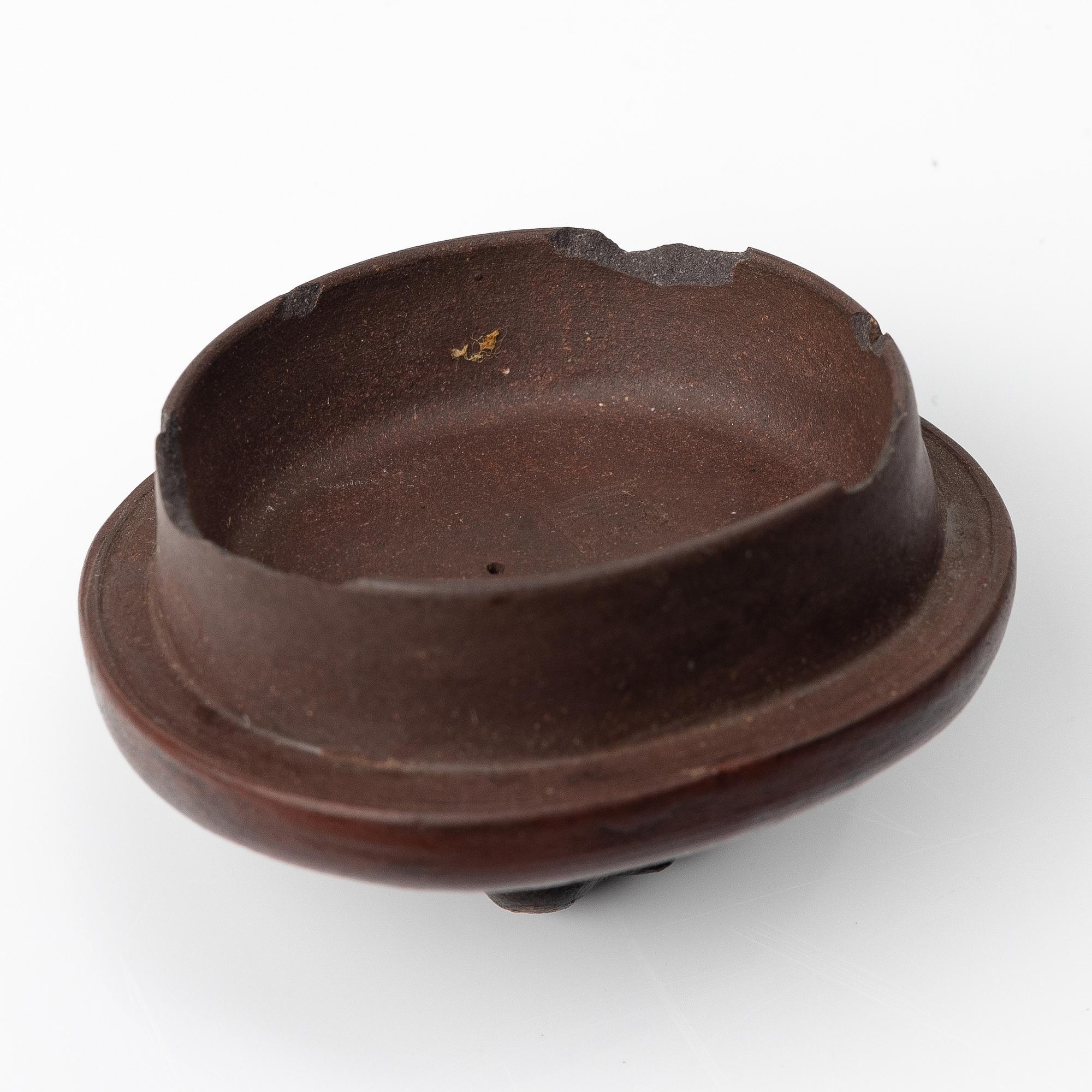 A Chinese 'hundred-fruit' yixing teapot, Qing dynasty (1644-1912).