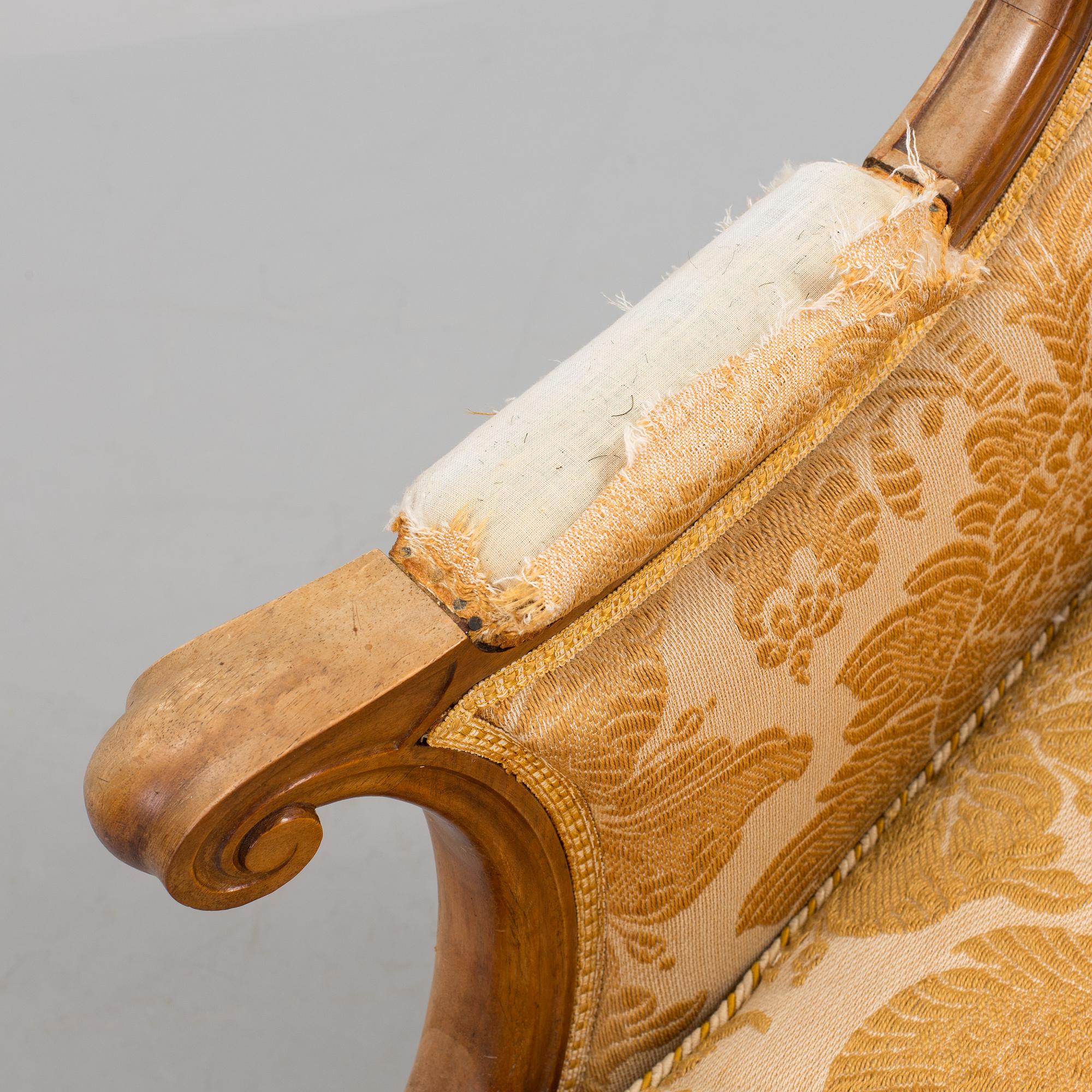 A Rococo style wing chair, first half of teh 20th Century.