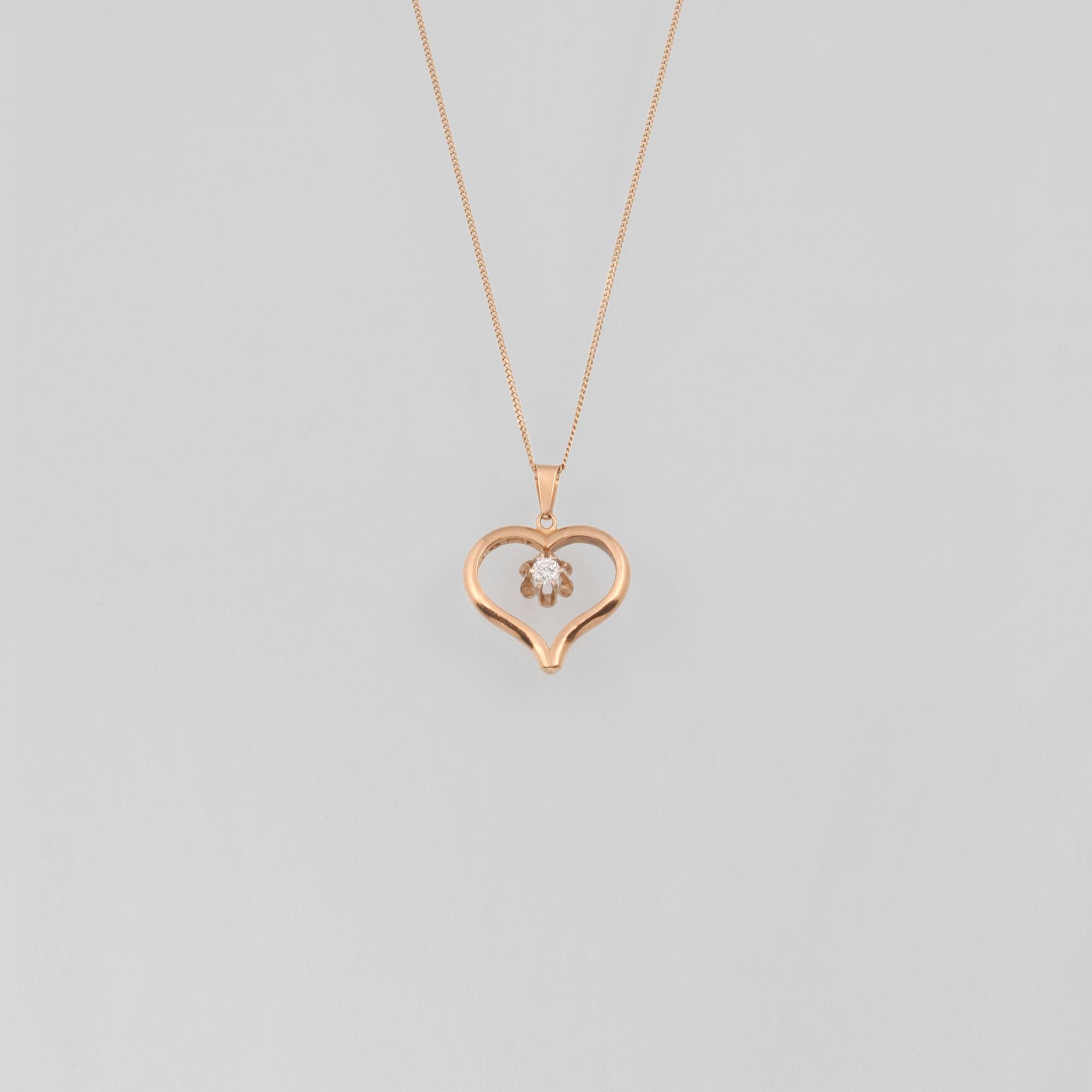 HÄNGE SAMT KEDJA, 18K guld samt briljantslipad diamant ca 0.10 ct. Vikt 6,2 gram.