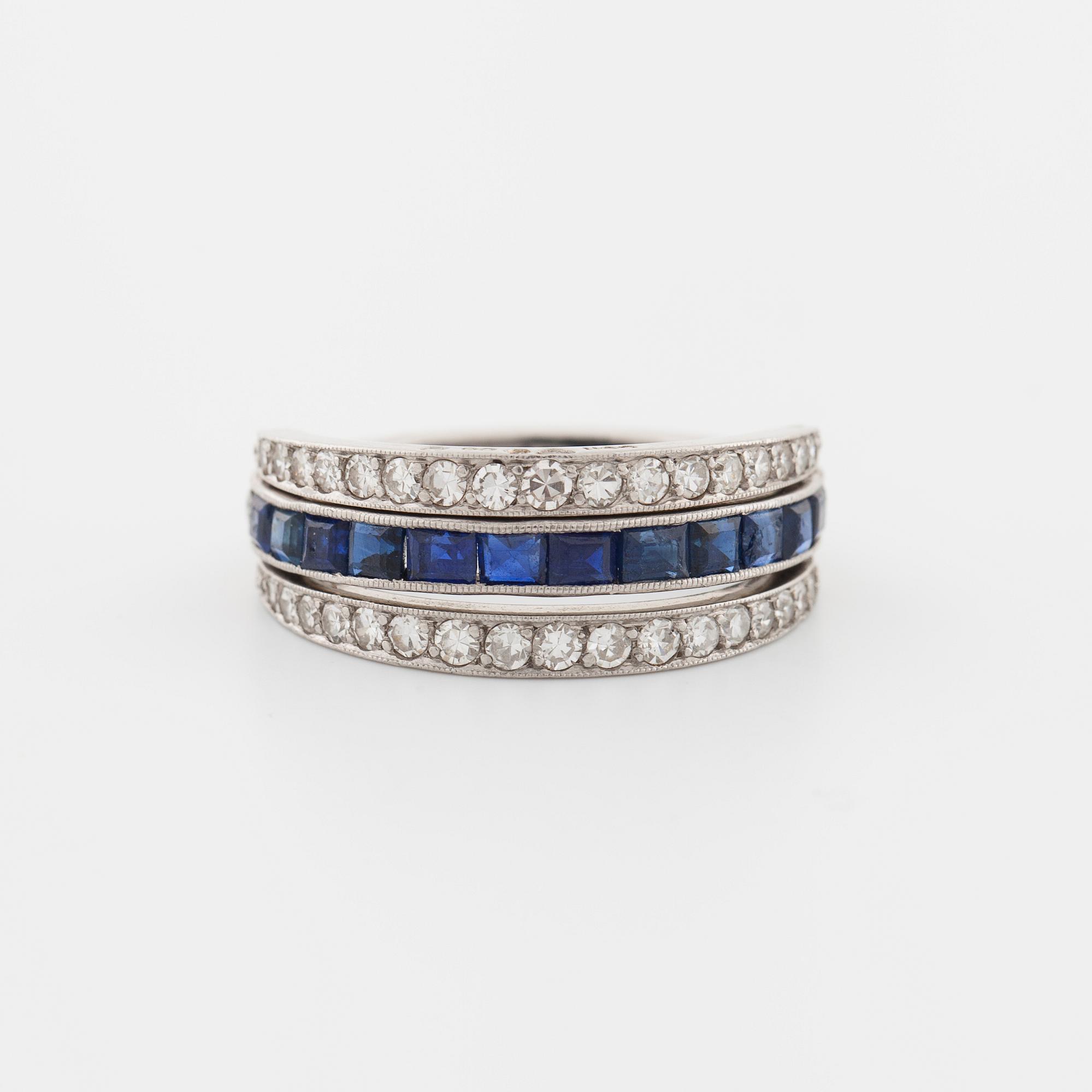 A square cut sapphire and single cut diamond ring.