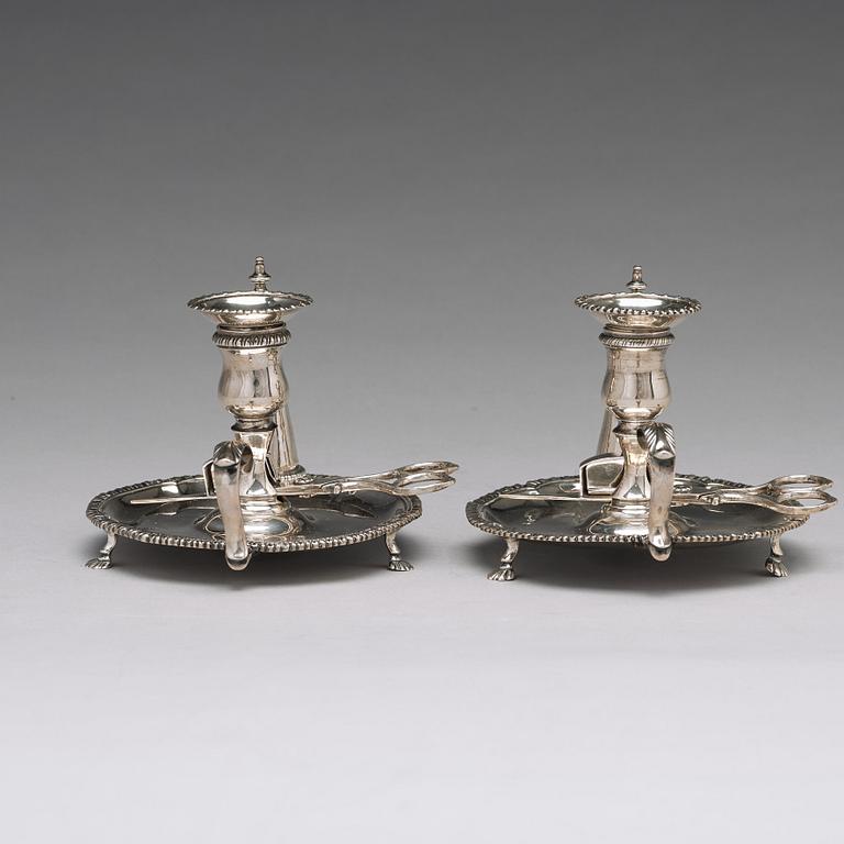 An English pair of 18th century silver chamber candlesticks, mark probobly of Ebenezer Coker, London 1770.