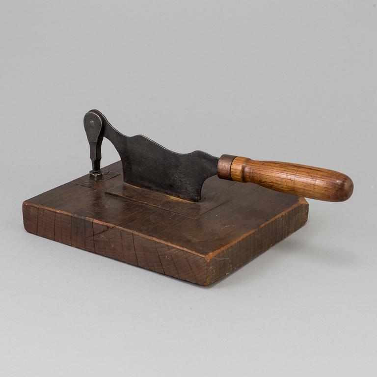 A 19TH CENTURY TOBACCO CUTTER, wood and iron.