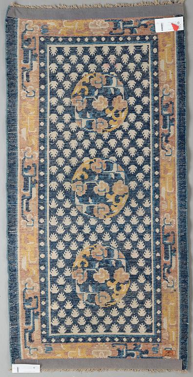 A RUG, an antique Ningxia, ca 137 x 67,5 cm, China, late Qing.