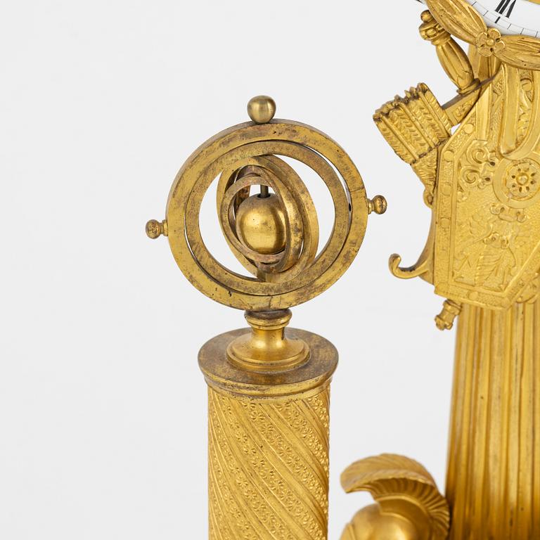 A French Empire ormolu figural mantel clock, early 19th century.