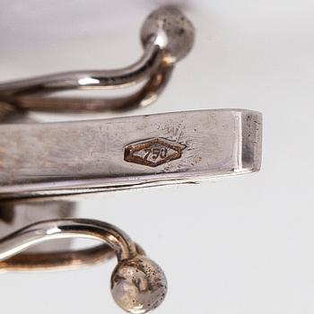 Rannekoru, 18K valkokultaa ja monivärisiä kiviä.