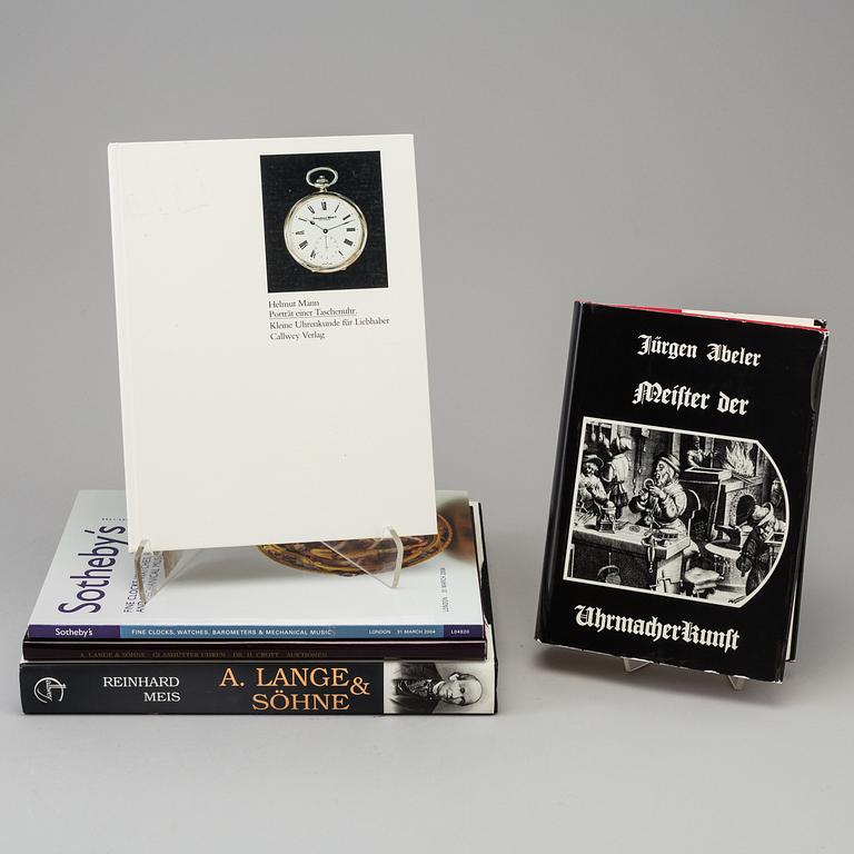 A set of 6 watch books.