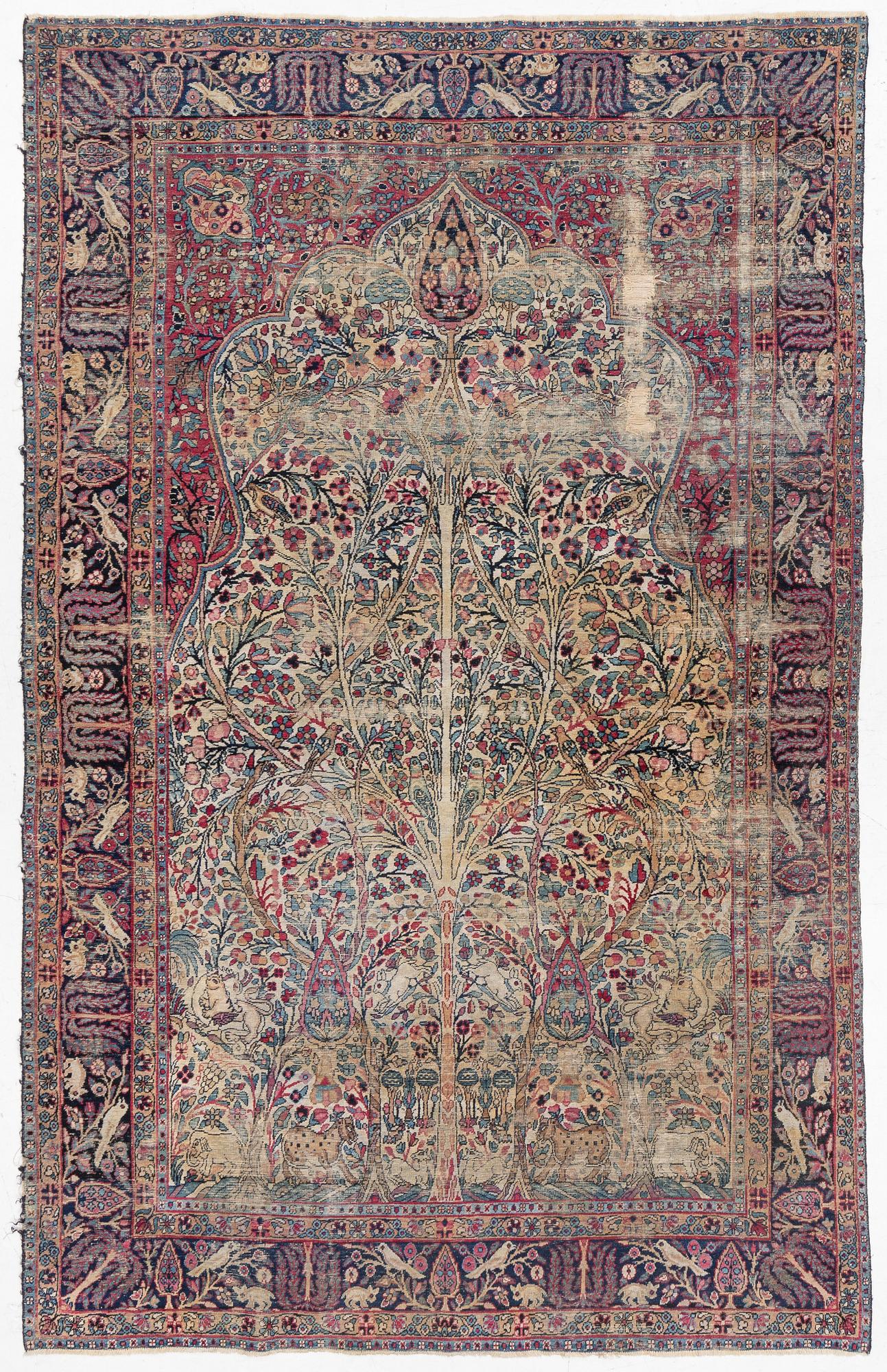 A semi-antique Kerman carpet, c. 325 x 203 cm.