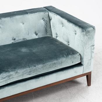 A contemporary velvet sofa, Jio Möbler.