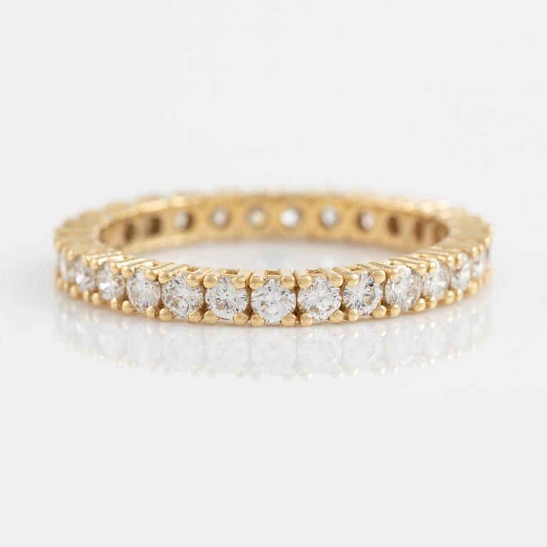 Brilliant cut diamond eternity ring.