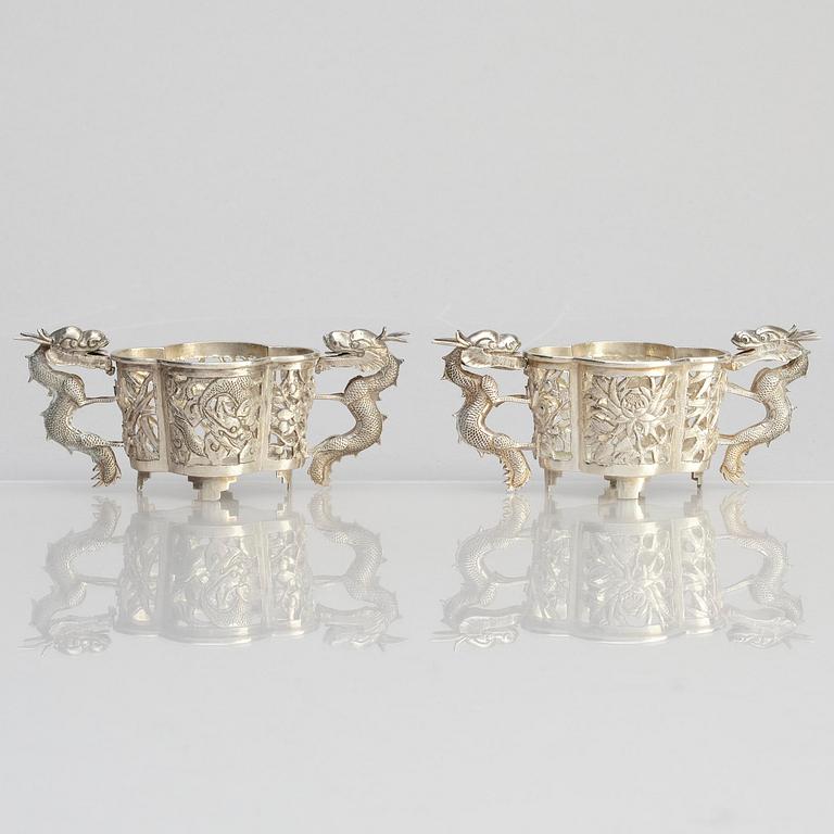 A pair of  Chinese silver cup holders/salts, 20th century.