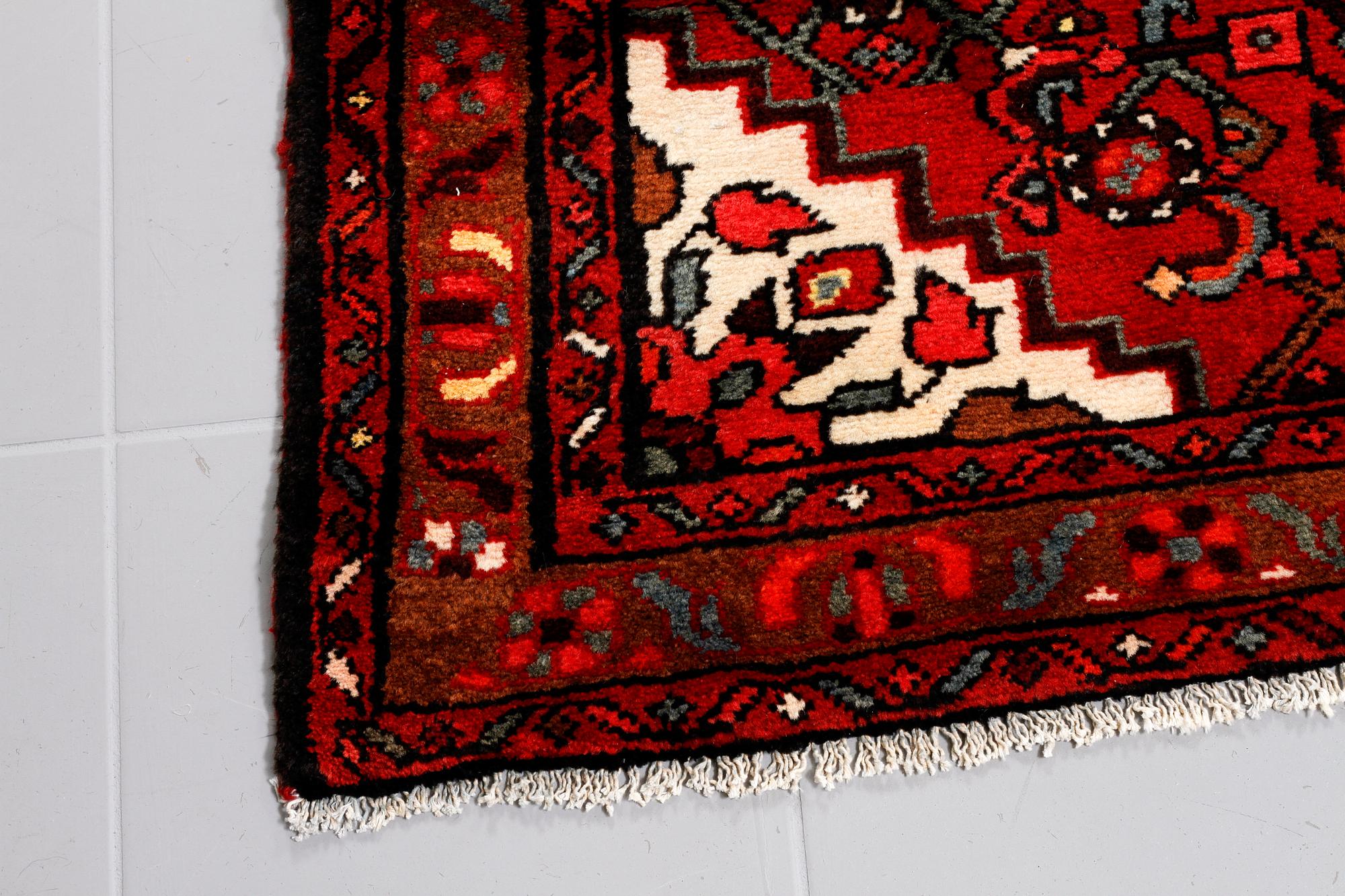 A Hosseinabad runner, 300 x 98 cm.