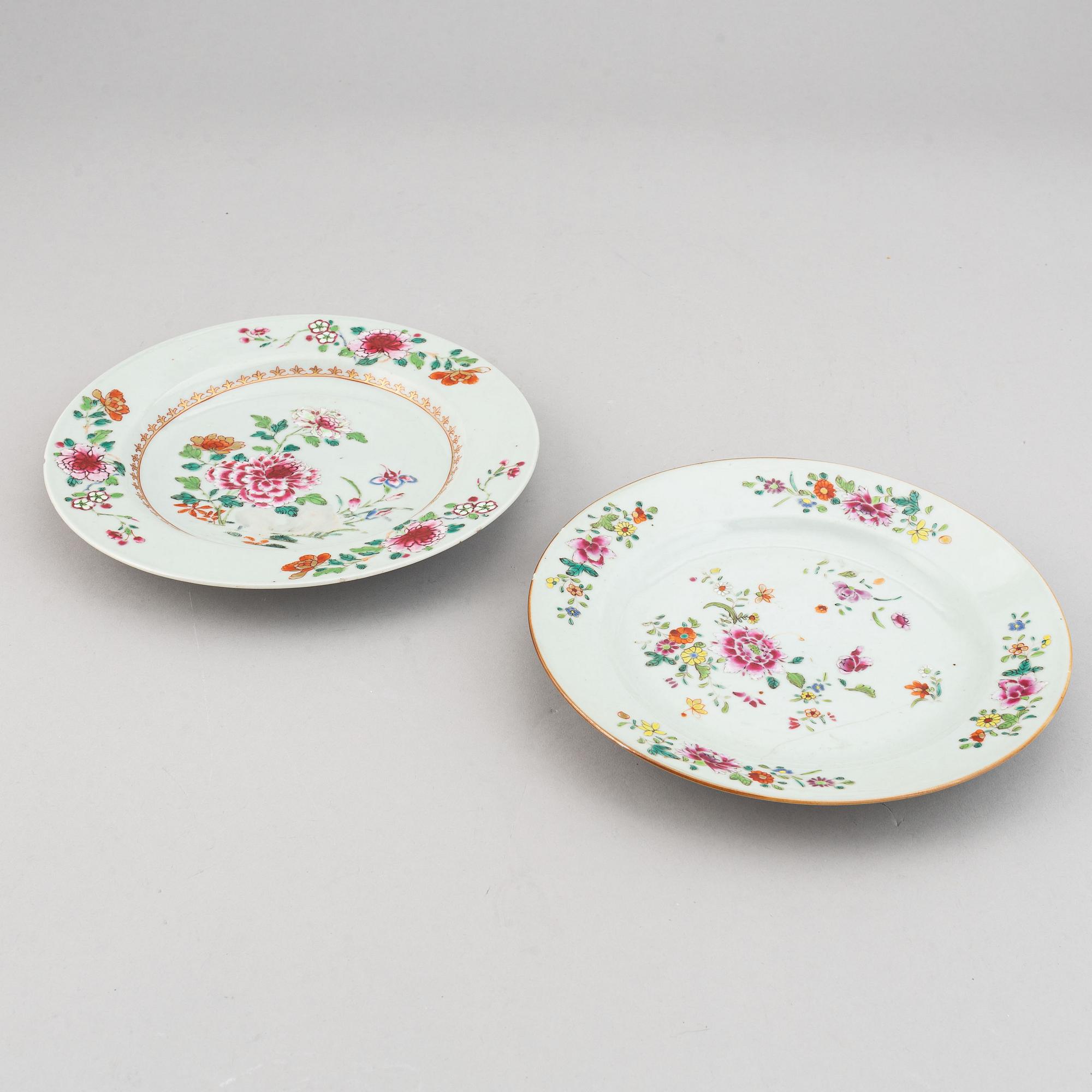 A set of two blue and white serving dishes, and two famille rose dinner plates, Qing dynasty, Qianlong (1736-95).