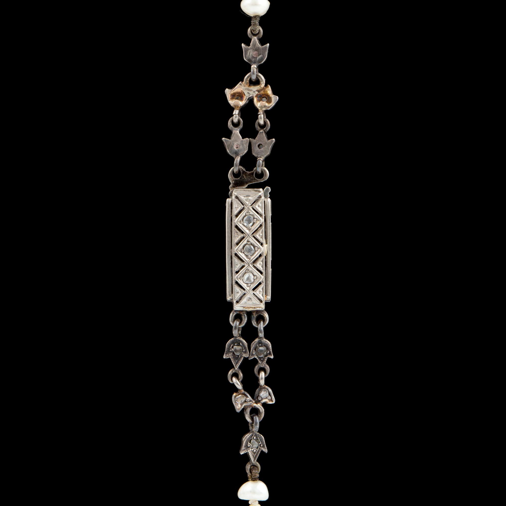 Pearl necklace, clasp with rose cut diamonds.
