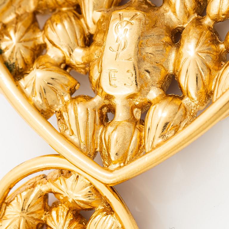 Yves Saint Laurent, earrings and brooch.