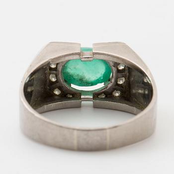 Ring with cabochon-cut emerald and single-cut diamonds.