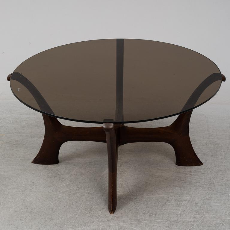 An end of the 20th Century glass top coffee table.