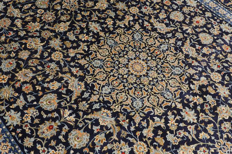 A carpet, Kashan signed, ca 395 x 277 cm.