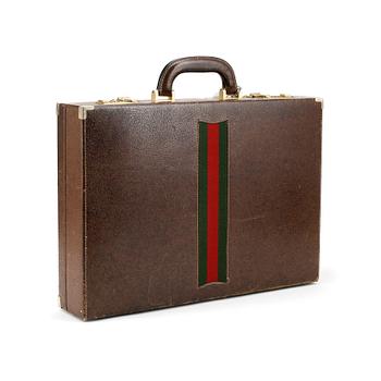 GUCCI, a brown leather briefcase.