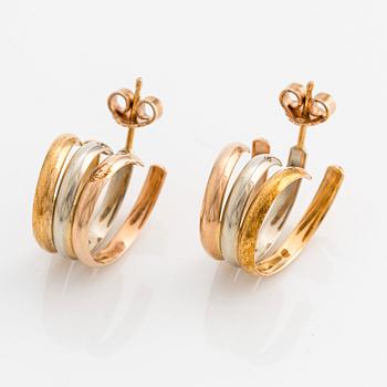 A pair of 18K gold Cartier earrings.