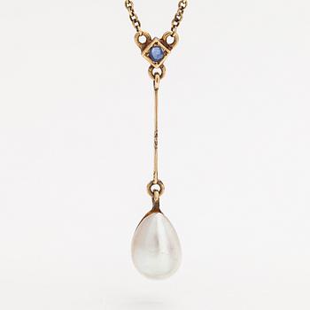 An 18K gold neckalce with a sapphire and cultured pearl.