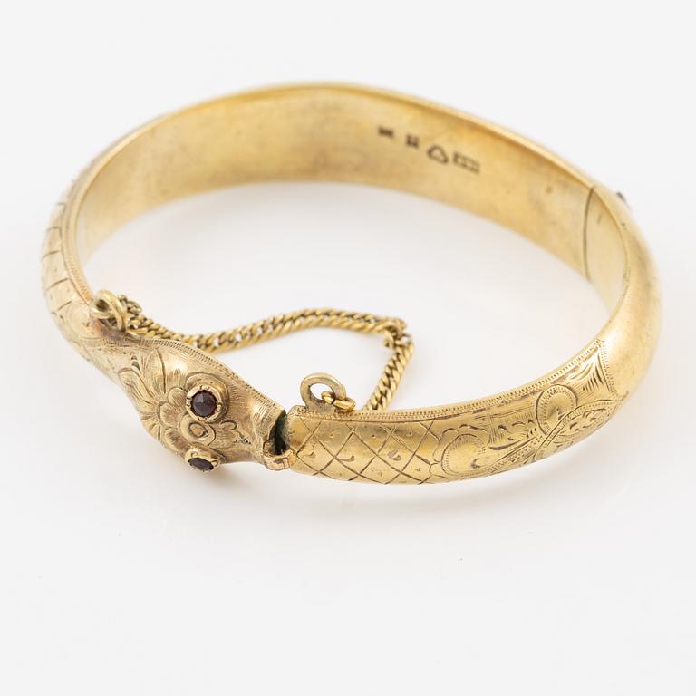 Armring in the form of a serpent, 18K gold with garnets as eyes, Johan Gustaf Kihlberg, Nyköping 1863.