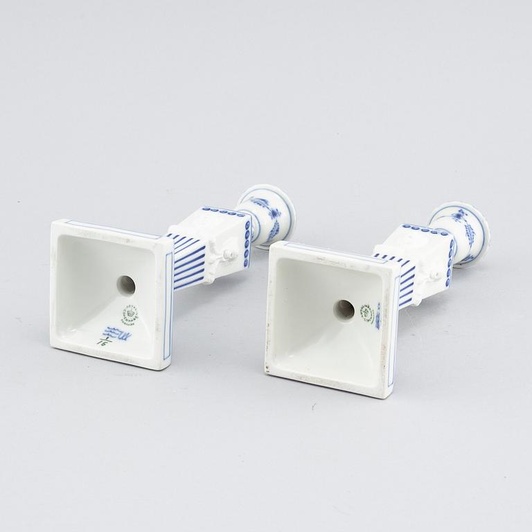 A pair of "Musselmalet" candlesticks in porcelain, by Royal Copenhagen, second half of the 20th century.