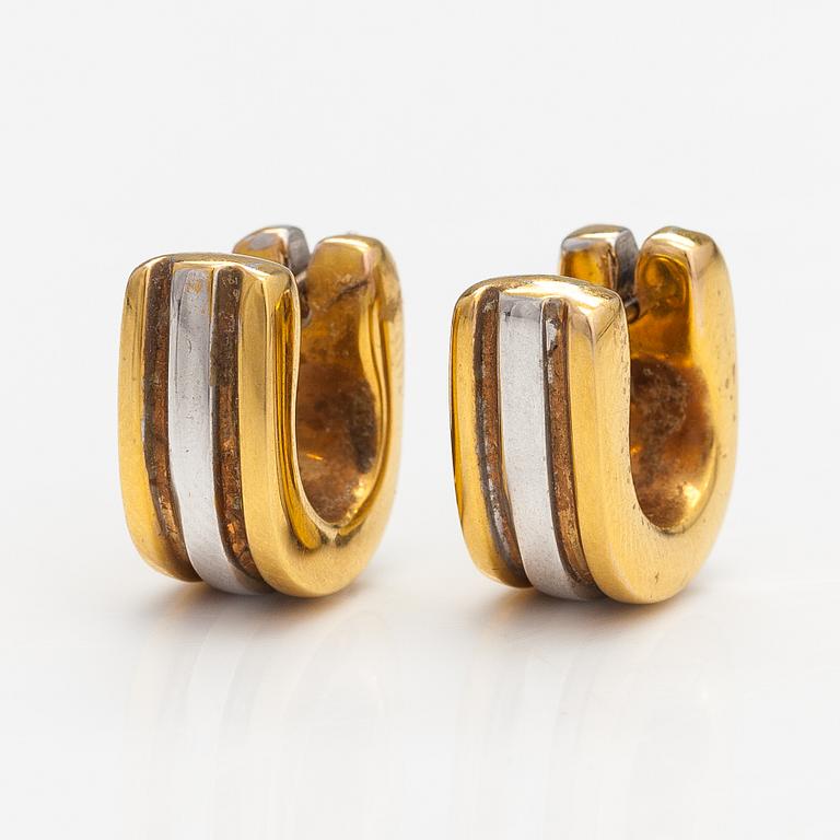 A pair of 14K gold earrings.