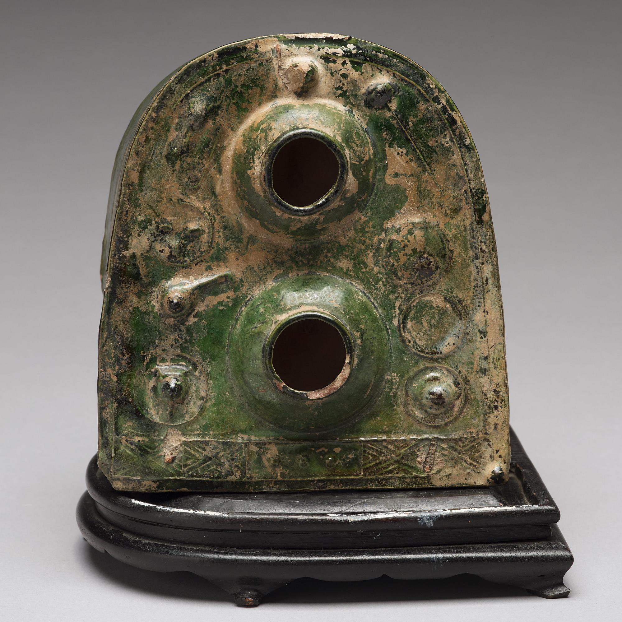 A green glazed pottery model of a stove, Han dynasty (206 BC-220 AD).