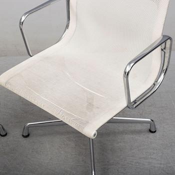 A pair of EA 107 chairs by Charles & Ray Eames, Vitra.