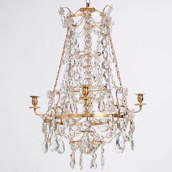 A Gustavian gilt-brass and cut-glass four-branch chandelier by O. Westerberg (master in Stockholm 1769-1881), dated 1795.