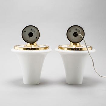 A pair of wall lamps designed by Hans-Agne Jakobsson, Markaryd, from the fourth quarter of the 20th century.