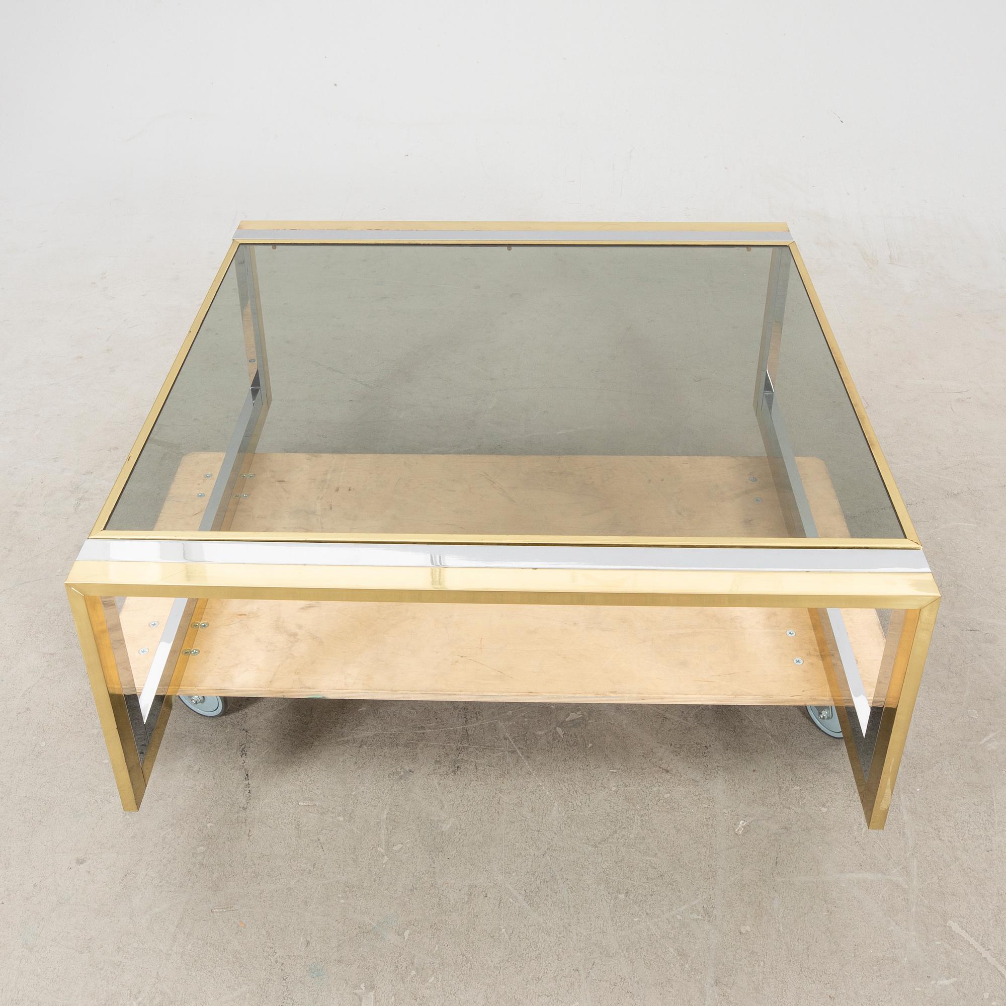 A glass and metal coffee table from Romeo Rega second half of the 20th century.