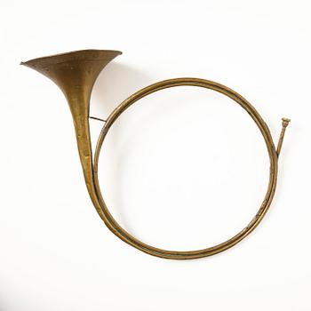 A brass hunting horn by Pierre Raoux (manufacturer of horns in Nancy, fl. ca 1723 -1789.).