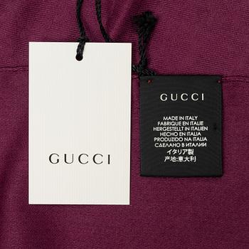 Gucci, a wool and silk mix "GG" jaquard shawl.