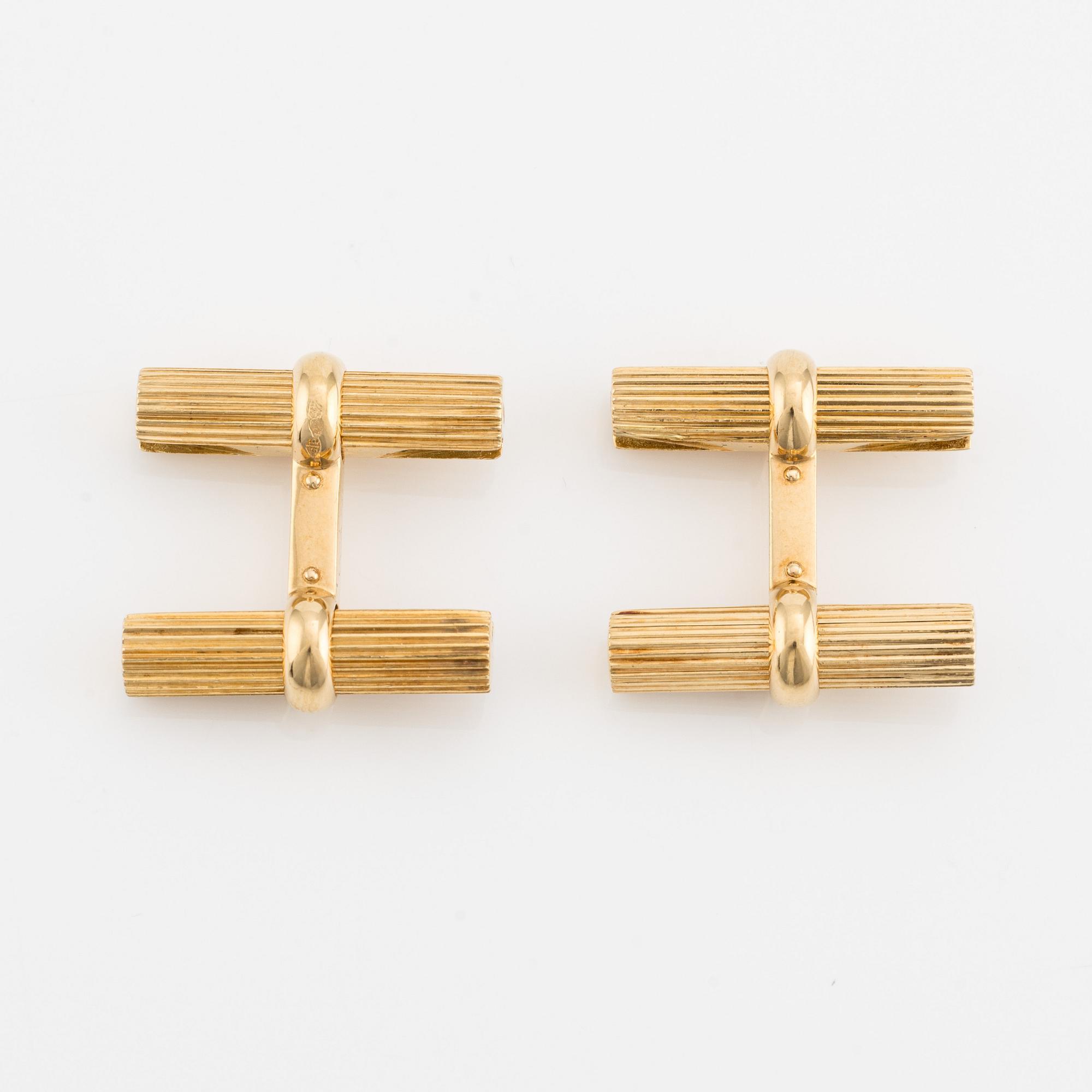 Van Cleef & Arpels, cufflinks with interchangeable parts in 18K gold and stone.