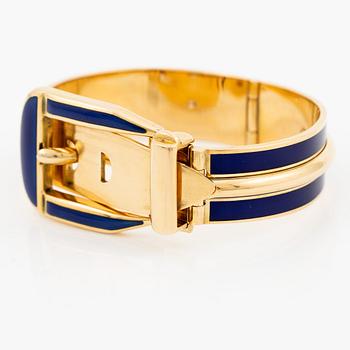 A Gucci bracelet 18K gold with blue enamel.