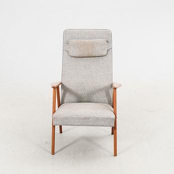 A 1960s teak armchair.