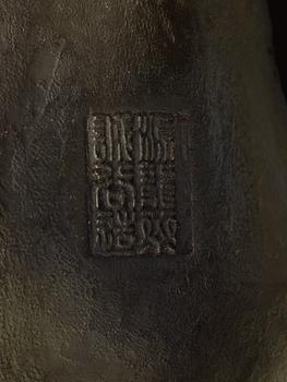 A large Japanese bronze sculpture of an elephant attacked by tigers, with seal mark, Meiji, circa 1900.