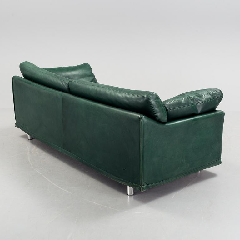 A "Fredrik" green leather sofa by Dux.