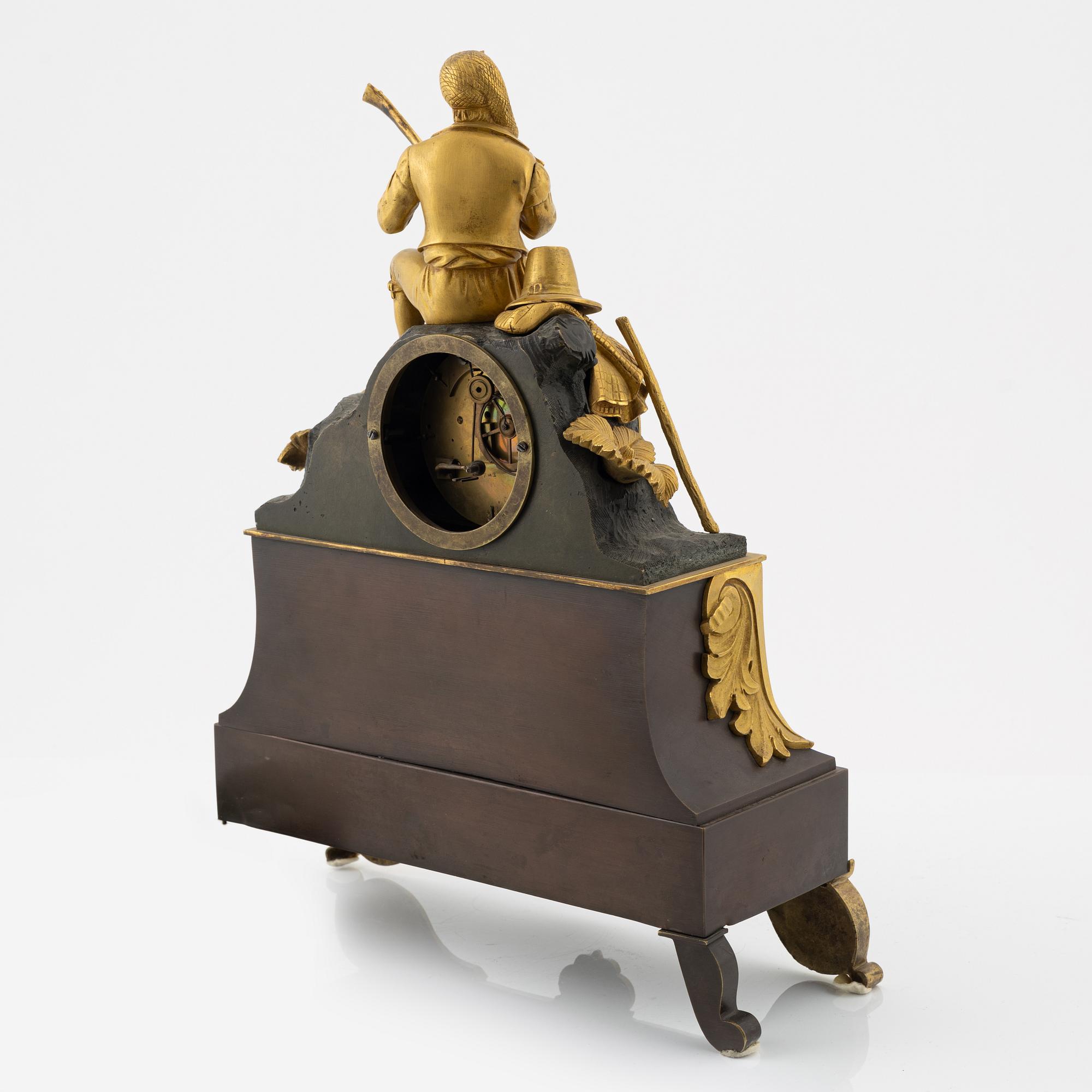 An ormolu and patinated bronze mantel clock, mid 19th Century.